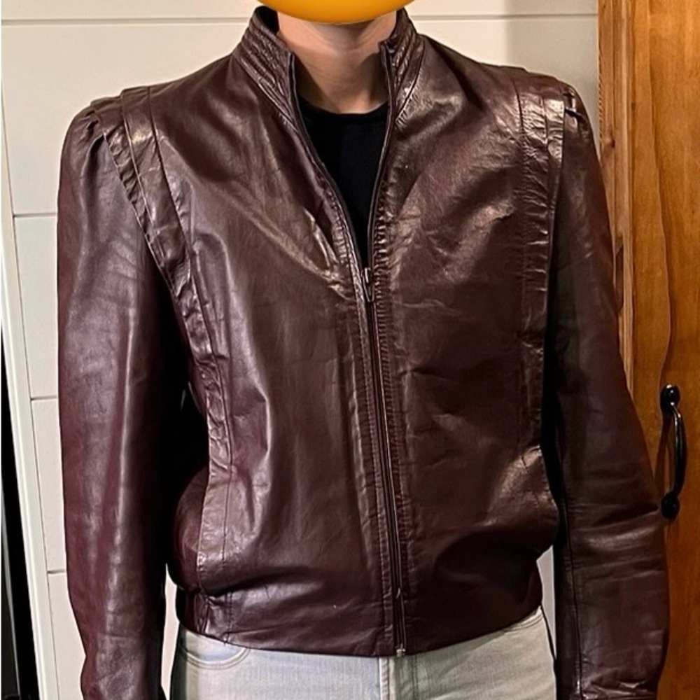 Berman’s burgundy leather jacket